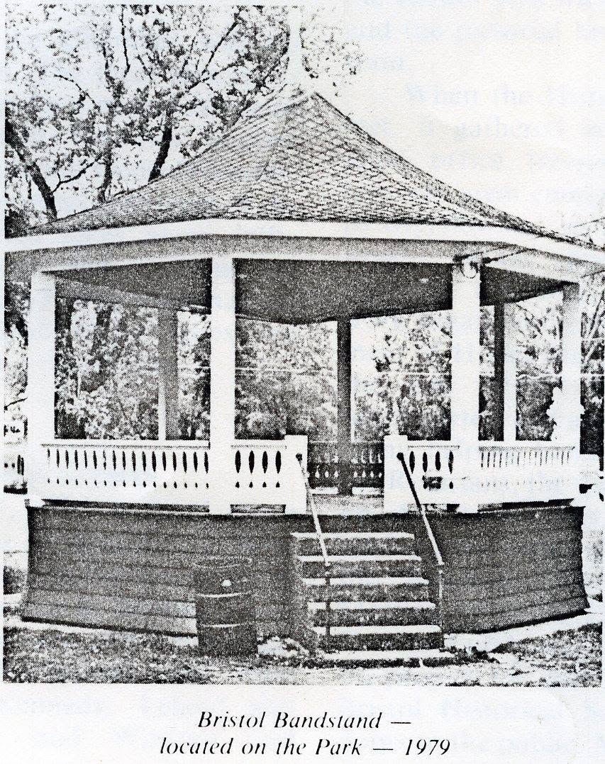 swifthouse_hotel_bristoltownband A white bandstand with a domed roof, open sides, and steps up to a porch in a park (caption reads: 'Bristol Bandstand — located on the Park — 1979').